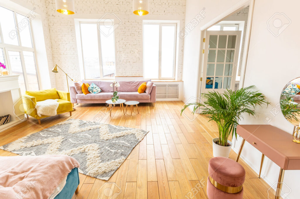 Cozy living room interior in a rental home with warm lighting and wood flooring.